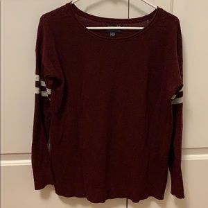 Burgundy sweater with stripes on sleeves